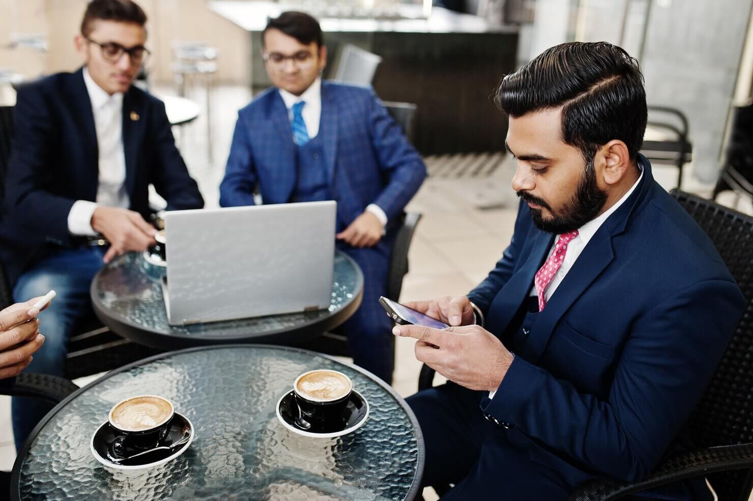 group indian business man suits sitting office cafe with laptop texting phones making photo coffee 627829 1491 (1)